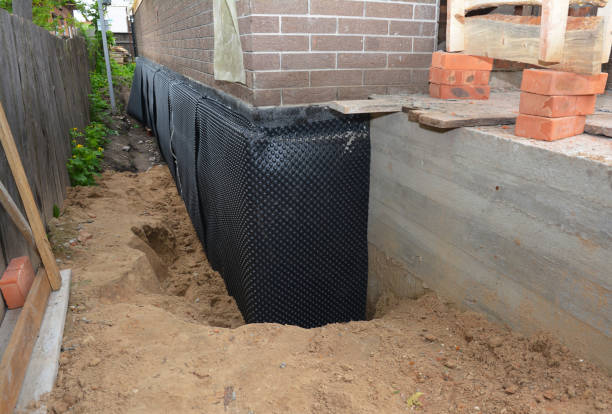 SJ Waterproofing Pros technician performing targeted Interior Drainage System assessment in Grafton, WI